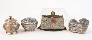 Tibetan silver flint striker and three Eastern silver and silver plated boxes, 19th and 20th century, ​​​​​​​the flint 10cm wide