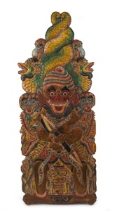 A Balinese carved timber plaque with polychrome finish, 19th/20th century, 109cm high, 42cm deep