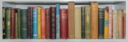 A collection of books over several shelves; very diverse subjects and condition; mainly hardcover. (130+) - 2