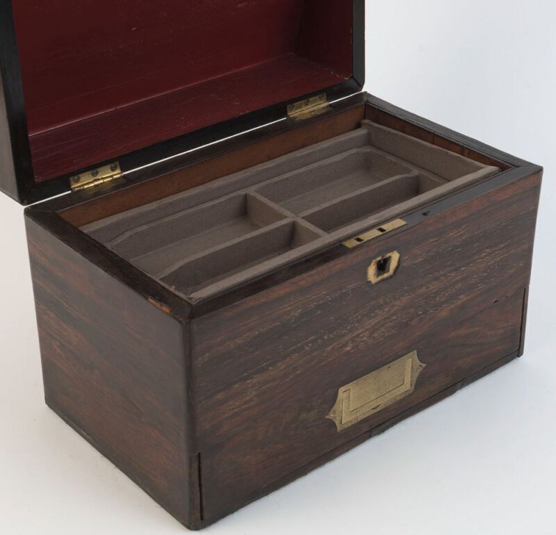 An antique rosewood slopetop jewellery box with single drawer and liftout compartments, 19th