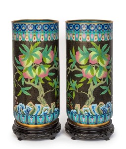 An impressive pair of Chinese cloisonne vases on carved wooden stands, 20th century, square seal mark to bases, each 57cm high overall, 27cm diameter