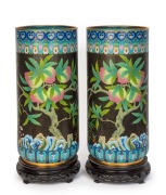 An impressive&nbsp;pair of Chinese cloisonne vases on carved wooden stands, 20th century, square seal mark to bases, each 57cm high overall, 27cm diameter