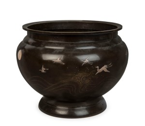 An antique Japanese bronze jardiniere inlaid with flying silver cranes and moon, Meiji Period, 19th/20th century, engraved in the moon "To Trissie From Allen, 5/4/22", ​​​​​​​28cm high, 35cm diameter