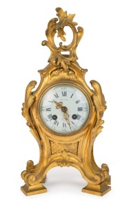 A fine antique French mantel clock in gilt bronze Rococo style case with time and strike movement and enamel dial, 19th century, ​​​​​​​36cm high