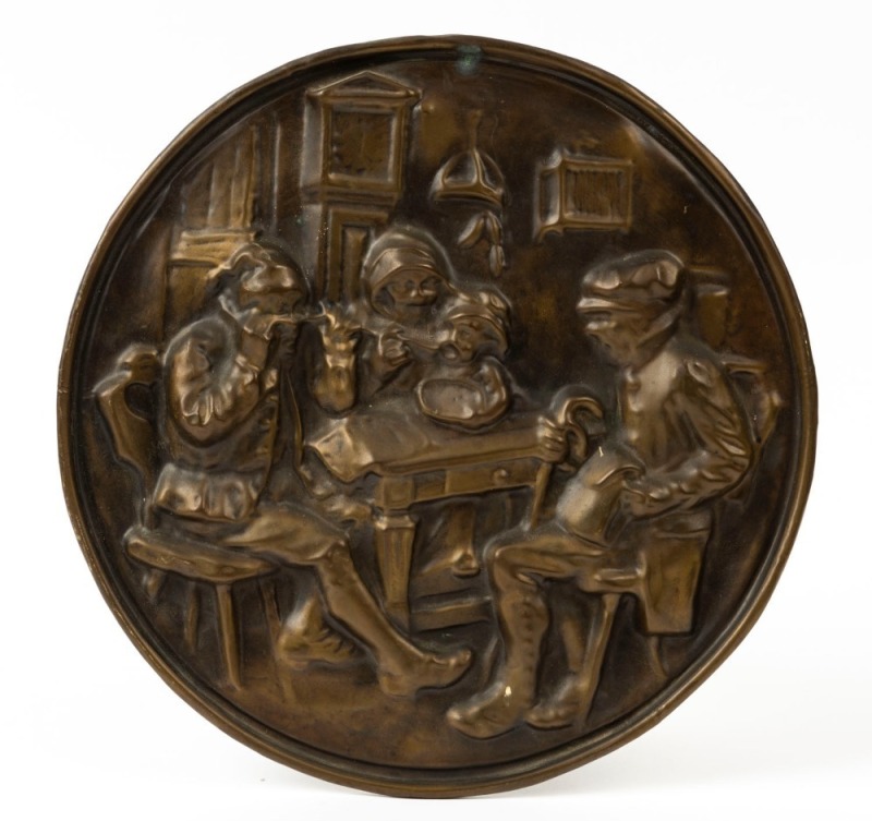 An antique circular wall plaque, embossed brass, late 19th century, 27cm diameter