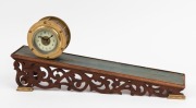 A novelty incline clock, 20th century, ​​​​​​​the clock 13cm diameter, the ramp 56cm long