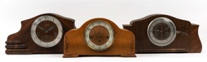 Three vintage timber cased mantel clocks, mid 20th century, the largest 22cm high, 44cm wide