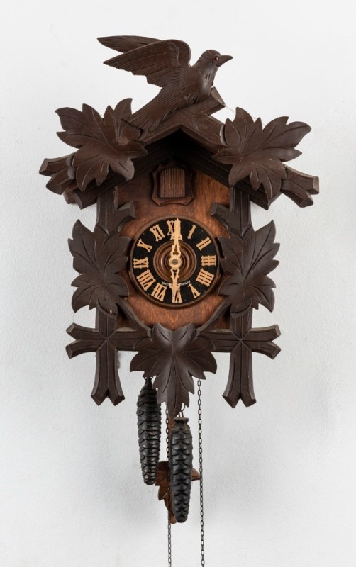 A German Cuckoo twin weight wall clock with carved leaves and birds, 20th century, ​​​​​​​39cm high