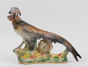 A German porcelain pheasant cased clock, 20th century, dial marked "MERCEDES, Made In Germany", ​​​​​​​31cm high, 47cm long