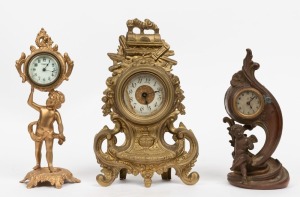 Three antique gilt metal cased table clocks, German and American, 19th and early 20th century, ​​​​​​​the largest 28cm high