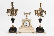 An antique French time only mantel clock in white marble case with urn top, together with a fine pair of five branch gilt metal and black slate candelabra garnitures, 19th century, ​​​​​​​the clock 30cm high, the candelabras 43cm high