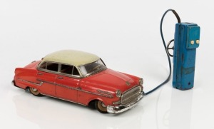 GAMA TOYS (GERMANY): battery operated, pressed steel Opel Kapitan saloon car, complete with remote control, car length 26cm, c.1950s.