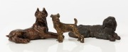 DOG FIGURINES: comprising Airedale Terrier in brass (length 8cm), Bull Mastiff in brass (length 15cm); also Irish Setter in cast iron (length 14cm); British/European, late 19th century. (3)