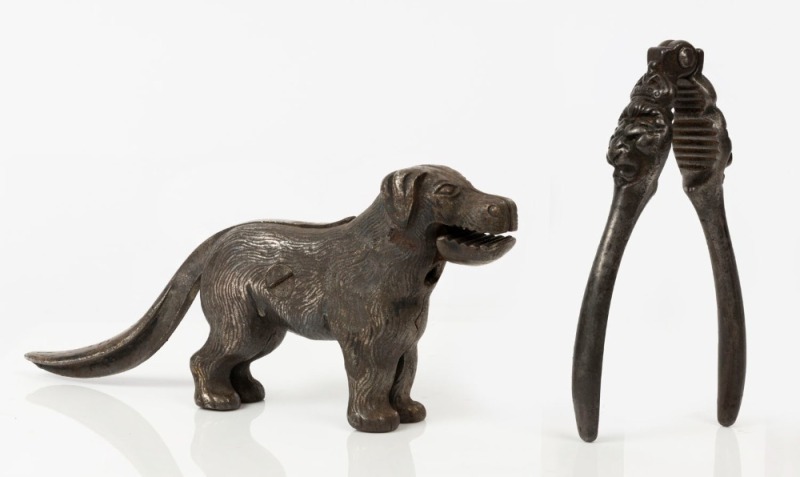 NUTCRACKERS: cast metal nutcracker in form of a dog, length 23cm; also Crowned Lion's Head nutcracker, length 15cm; British made, late 19th/early 20th century. (2 items)