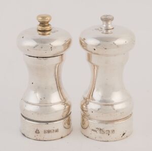 A pair of English sterling silver pepper mills, 20th century, 11cm high