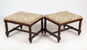 A pair of antique English oak footstools with bobbin turnings and floral upholstery tops, early 20th century, 42cm high, 58cm wide, 48cm deep