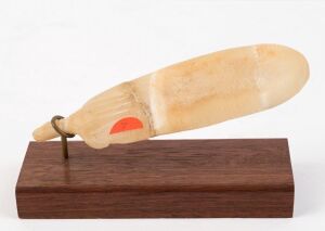 A New Kingdom alabaster cosmetic pallet, in spatula form, the reverse with a hand projecting from the handle carved in relief.From the Nikos Paschalis (1918 - 1948) Collection, inherited in 1965 by his sister, Assimina Paschalis, later by descent to Dr W. Galanos of Melbourne, Australia. Ex: Mossgreen Auctions, Melbourne
