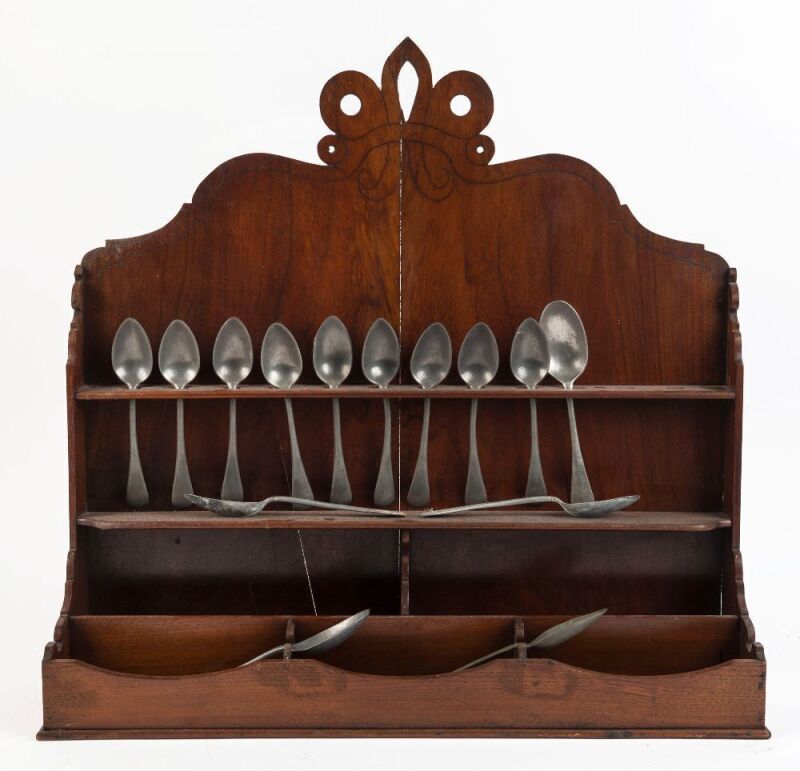 A Georgian mahogany spoon rack and fourteen assorted pewter spoons, 18th and 19th century, ​​​​​​​the rack 66cm high, 63cm wide, 16cm deep