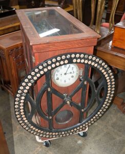 An imposing antique time recording clock in oak and glass cabinet with cast iron outer dial, 19th century, the case 90cm high, 44cm wide, 90cm deep, the outer dial 75cm diameter