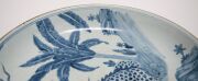 A Chinese blue and white charger with foo dog in landscape decoration, Guangxu Period late 19th century, square seal mark to base, 8cm high, 40cm diameter - 5