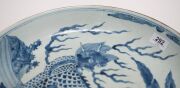 A Chinese blue and white charger with foo dog in landscape decoration, Guangxu Period late 19th century, square seal mark to base, 8cm high, 40cm diameter - 7