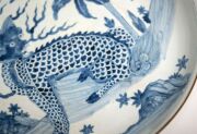 A Chinese blue and white charger with foo dog in landscape decoration, Guangxu Period late 19th century, square seal mark to base, 8cm high, 40cm diameter - 9