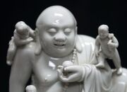 Blanc de chine Chinese porcelain statue of a Buddha surrounded by boys 19th/20th century,square seal mark to back,24.5cm high  - 2