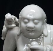 Blanc de chine Chinese porcelain statue of a Buddha surrounded by boys 19th/20th century,square seal mark to back,24.5cm high  - 3