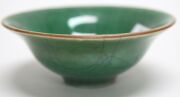 An antique Chinese celadon and jade green porcelain bowl with carved timber stand, 18th century or earlier, 7cm high, 19cm wide - 5