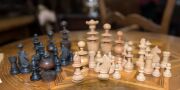 An antique walnut circular games table with chess and gaming pieces, 19th century, 74cm high 60cm diameter - 4