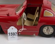 MARKLIN: 1993 wind-up 'Museumsmodell' Mercedes 300SL (model #1092), red paintwork; with key, certificate and housed in original box. - 3