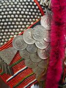 AKHA 'PHAMI' HEADDRESS: Made from Yunnan "Dragon" coins, 19th century Burmese glass beads, hand-made silver moon-shaped buttons, chains, pendants, tassels; gibbon fur; red-dyed chicken hackles and horsehair. circa 1930s. - 5