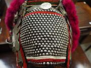 AKHA 'PHAMI' HEADDRESS: Made from Yunnan "Dragon" coins, 19th century Burmese glass beads, hand-made silver moon-shaped buttons, chains, pendants, tassels; gibbon fur; red-dyed chicken hackles and horsehair. circa 1930s. - 8