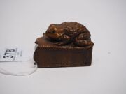 Two antique Japanese carved boxwood netsuke of a toad and a Foo dog, Meiji period, 19th century, the toad 4.8cm wide - 3