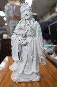 Blanc de chine porcelain statue of a man and child 19th/20th century,42cm high - 2