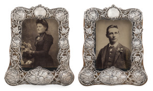 A pair of English sterling silver and oak "Chorus Of Angels" picture frames, by William Comyns, London, circa 1898, with period cabinet salon portrait photographs, 22 x 18cm each