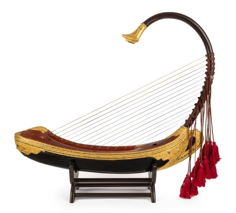 SAUNG Burmese harp of boat form, on stand, 20th century, 79cm high overall, 83cm long