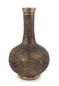An antique Tibetan silver plated vase with ornate embossed and engraved decoration, 19th century, 38cm high