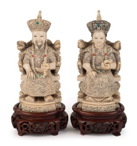 A pair of Chinese carved ivory ancestor statues on carved wooden stands, early to mid 20th century, ​​​​​​​18cm high overall