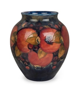 MOORCROFT "POMEGRANATE" English pottery vase with blue ground, circa 1930, impressed "Moorcroft, Made In England" with blue underglaze signature, 21cm high, 17cm wide