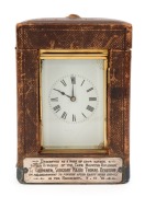 BOER WAR. Antique French repeater carriage clock in brass case with enamel dial and Roman numerals, housed in original embossed leather case, 19th century. (Movement running). Bears a silver plaque inscribed "Presented As A Mark Of Their Esteem. By The Of - 2