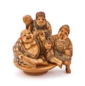 A Japanese carved ivory netsuke figural group with hand-painted finish, two character seal mark to base, ​​​​​​​5.5cm high, 5cm wide