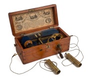 MAGNETO-ELECTRIC MACHINE in mahogany case with lithograph label inside the lid, 19th century, ​​​​​​​12cm high, 26cm wide, 12cm deep