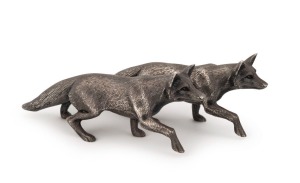 A pair of English sterling silver fox statues, 20th century, ​​​​​​​16cm long, 470 grams total