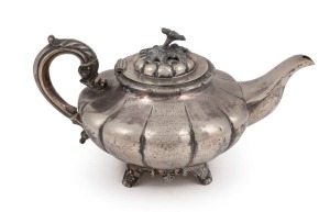 An antique Irish sterling silver teapot stamped "J.M.", Dublin, circa 1837, 17cm high, 32cm wide, 970 grams
