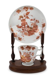 SPODE English porcelain "London" shape cup and saucer with hand painted gilt Chinese decoration; together with a vintage custom made display stand, circa 1830, 23cm high on stand.