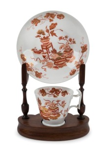 SPODE English porcelain "London" shape cup and saucer with hand painted gilt Chinese decoration; together with a vintage custom made display stand, circa 1830, 23cm high on stand.