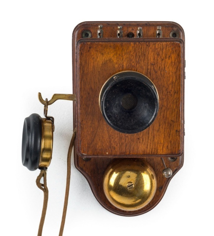 An antique timber cased wall phone, early 20th century, ​​​​​​​23cm high