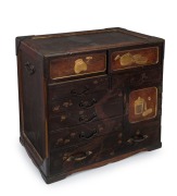 An antique Japanese travelling cabinet with 6 drawers and 2 doors, decorated with gilded panels and bronze mounts, Meiji period 19th/20th century, ​​​​​​​46cm high, 49cm wide, 32cm deep
