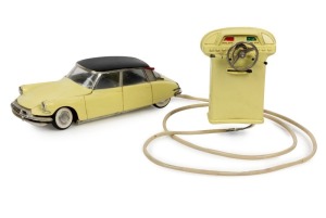 GÉGÉ (FRANCE): battery operated, pressed steel Citroen DS19 saloon car, yellow and black paintwork, complete with remote control, car length 26cm, c.1960s.